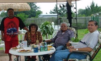 My cousin John and his wife, Chai and my nephew, Johnny in their backyard in Middleburg, FL